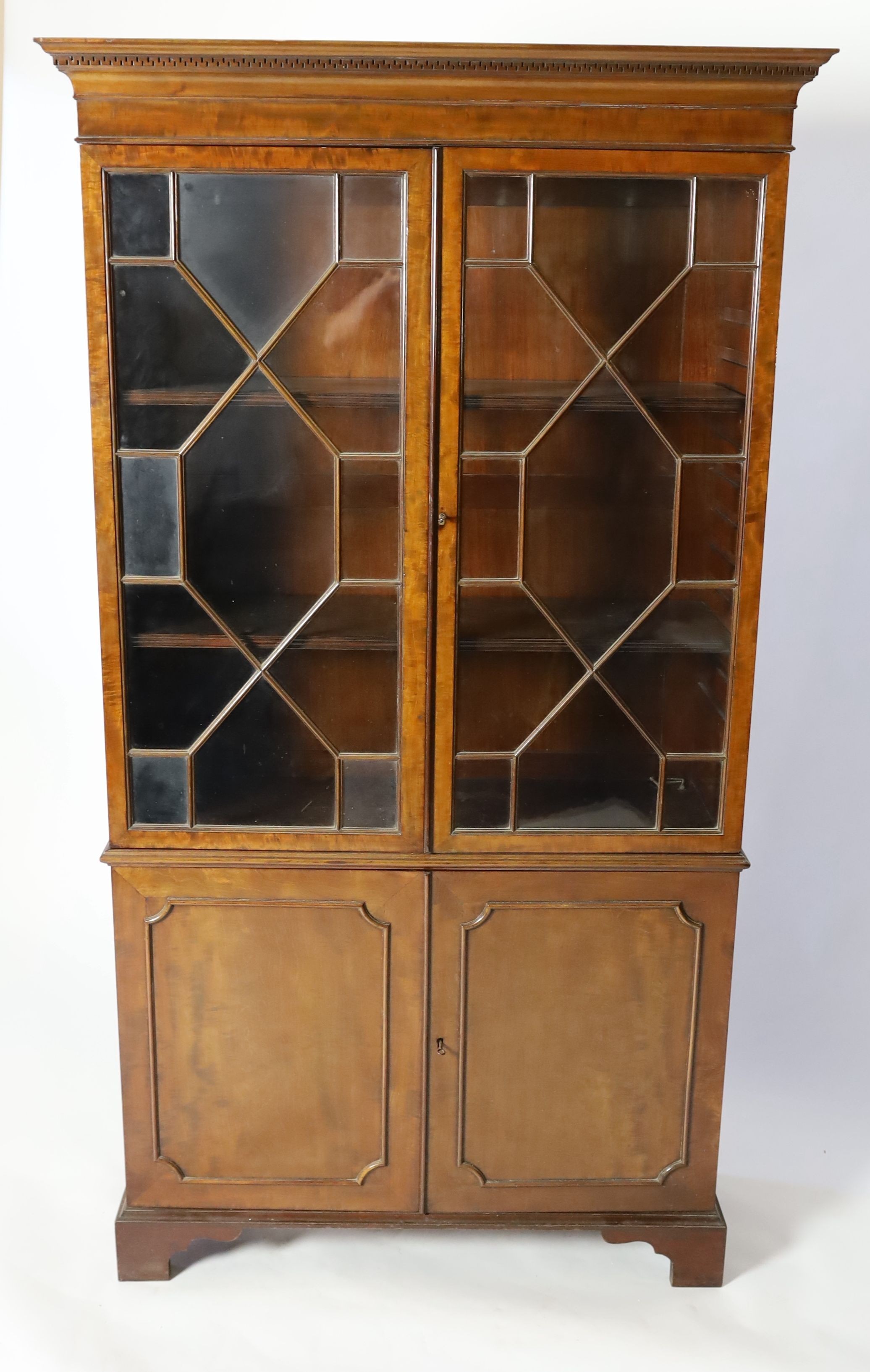 A reproduction George III style mahogany bookcase cupboard, width 106cm depth 37cm height 192cm